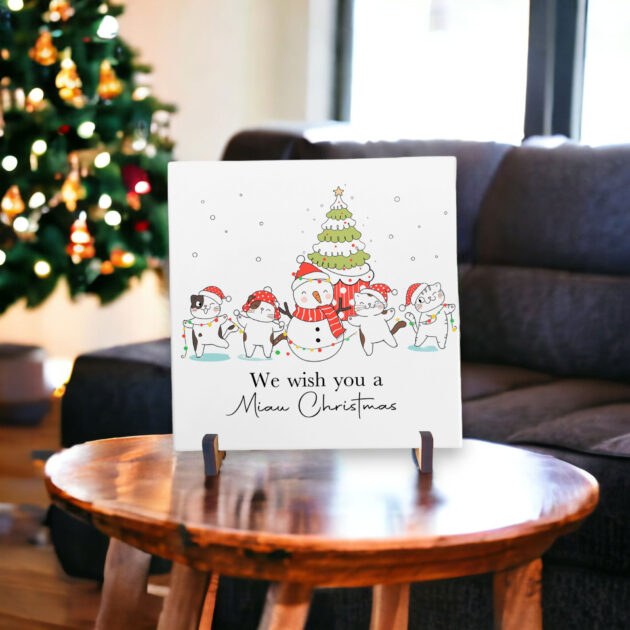 Azulejo decorativo de Natal com desenho de gatinhos com a frase We wish you a Miau Christmas 